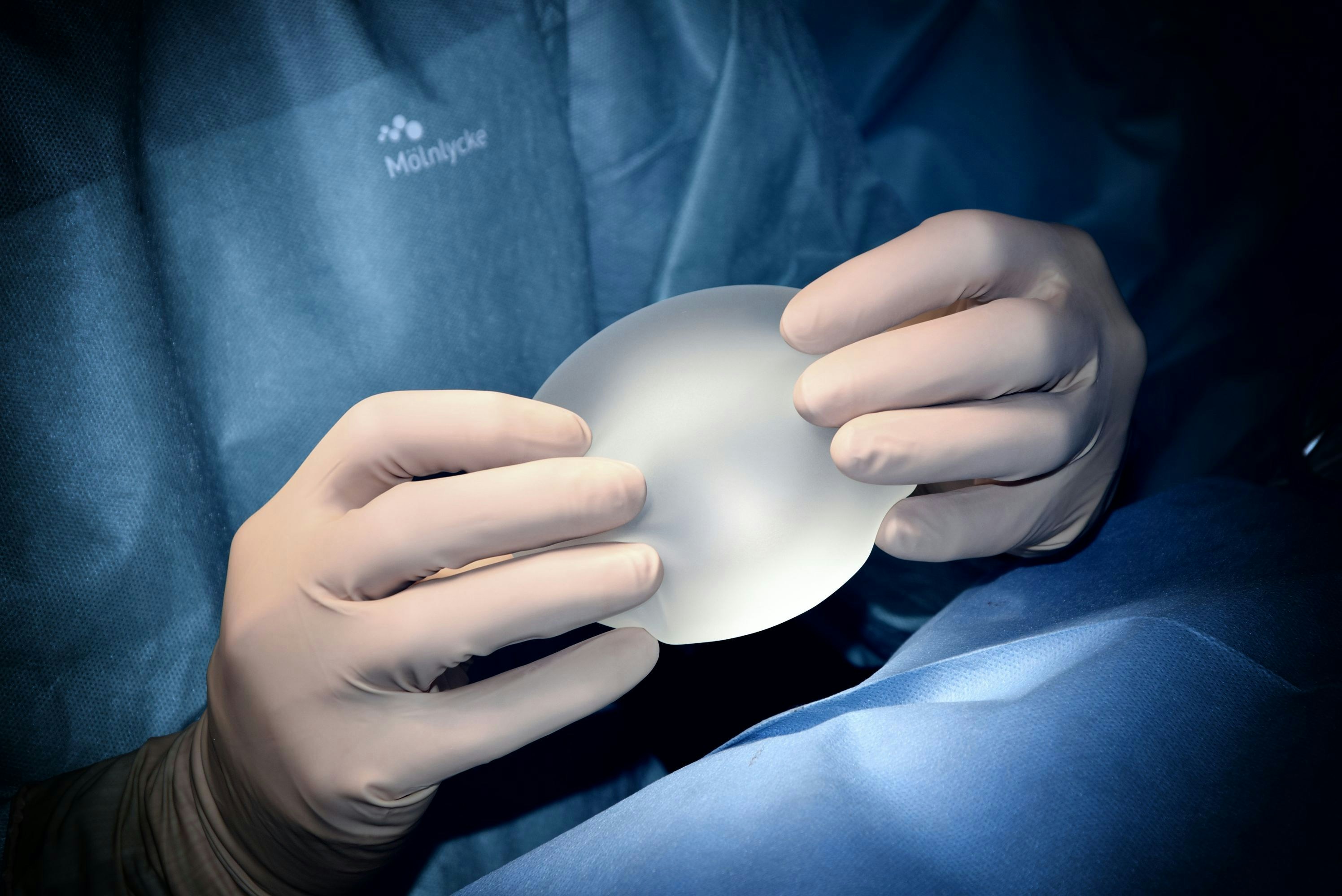 Modern cohesive silicone breast implant on a clinical surface